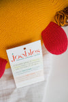 A product tag attached to a knitted toy reads: joobles: responsible, sustainable, adorable and describes the toy as organic, fair trade, and supports education.